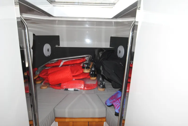  Yacht Photos Pics Interior cabin of 2015 XO Boats 270 RS with life jackets and storage.