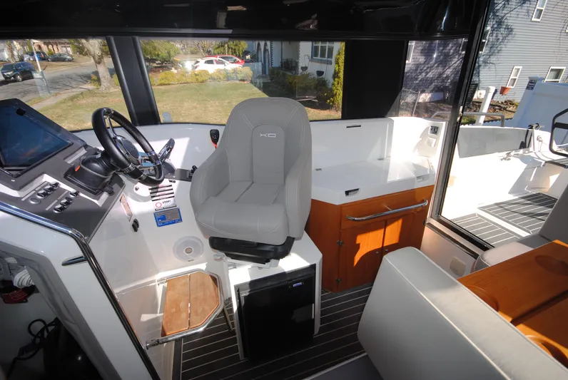  Yacht Photos Pics Interior of 2015 XO Boats 270 RS, featuring helm, seating, and storage.