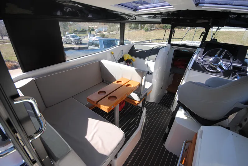  Yacht Photos Pics Interior of 2015 XO Boats 270 RS, featuring seating and helm with modern design.
