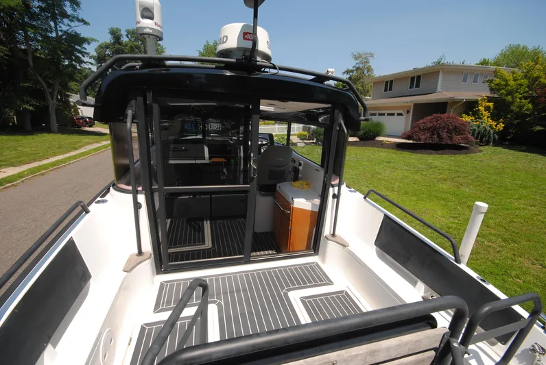  Yacht Photos Pics 2015 XO Boats 270 RS on driveway, showcasing interior and exterior design features.