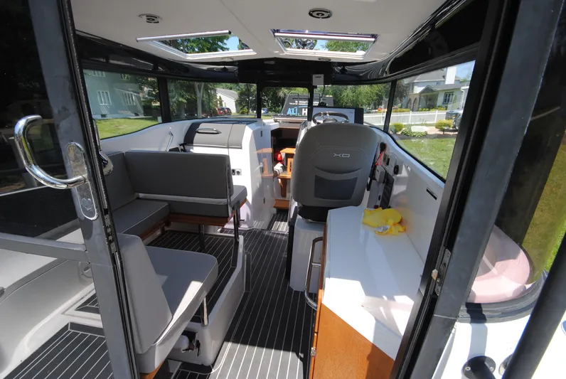  Yacht Photos Pics Interior of 2015 XO Boats 270 RS, featuring seating and helm station.