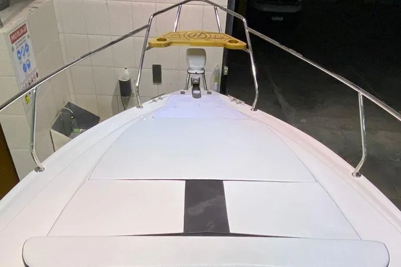  Yacht Photos Pics Bow view of 2025 Hanover 305 boat with sleek design and stainless steel railings.