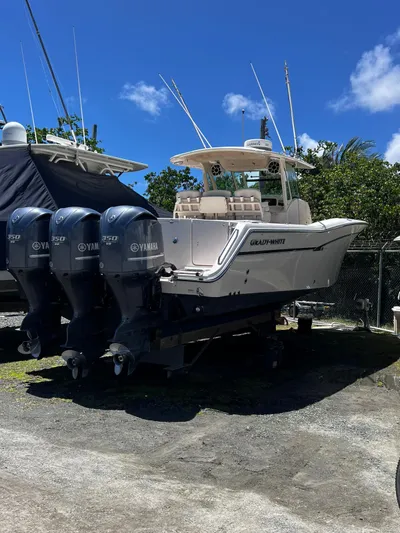  Yacht Photos Pics 2012 Grady-White 366 Canyon boat with triple Yamaha engines on a sunny day.