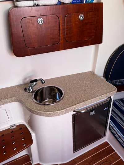  Yacht Photos Pics 2012 Grady-White 366 Canyon boat interior with sink, countertop, and storage.