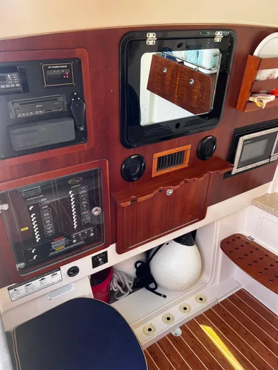  Yacht Photos Pics 2012 Grady-White 366 Canyon boat interior control panel with wooden accents.