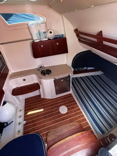  Yacht Photos Pics 2012 Grady-White 366 Canyon cabin interior with kitchenette and seating area.
