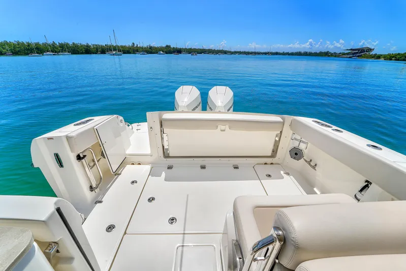  Yacht Photos Pics 2024 Boston Whaler 325 Vantage boat interior with scenic water view.