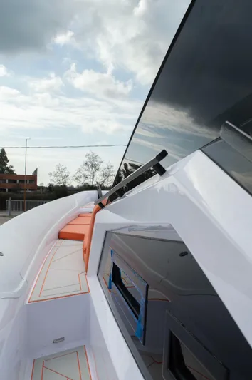  Yacht Photos Pics Modern DNA 46 yacht, 2025 model, featuring sleek design and luxurious deck under a cloudy sky.