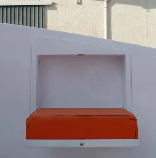  Yacht Photos Pics Orange cushioned seat in a modern, minimalist design, DNA 46 model, 2025.