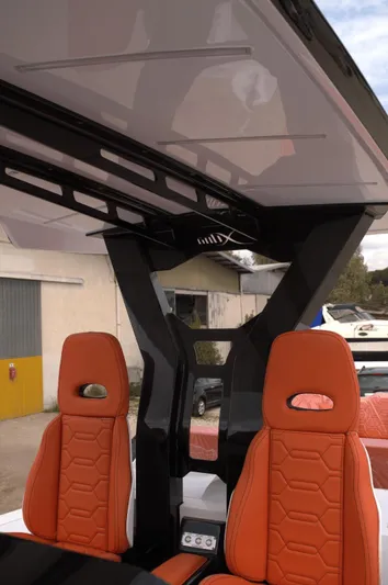  Yacht Photos Pics 2025 DNA 46 boat interior with orange seats and modern design elements.