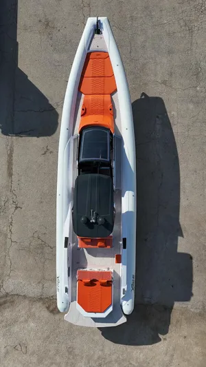  Yacht Photos Pics Aerial view of 2025 DNA 46 boat with orange and black seating.