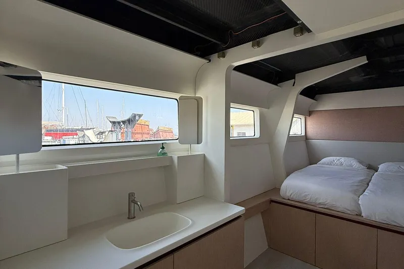 Highland Fling 18 Yacht Photos Pics Interior of 2023 Gunboat 80 yacht, featuring a modern bedroom and large windows.