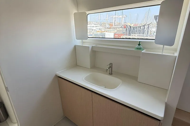 Highland Fling 18 Yacht Photos Pics Modern bathroom sink on 2023 Gunboat 80 yacht with marina view.