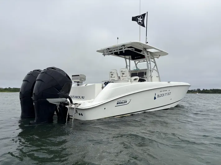 Block It Out Yacht Photos Pics 2005 Boston Whaler 320 Outrage boat with dual engines on water.