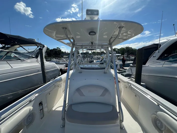 Block It Out Yacht Photos Pics 2005 Boston Whaler 320 Outrage boat docked under clear blue sky.