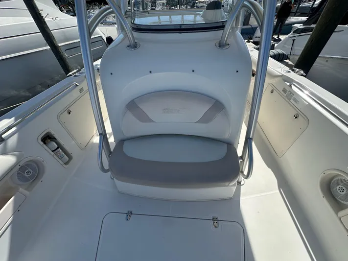 Block It Out Yacht Photos Pics 2005 Boston Whaler 320 Outrage boat interior with seating and storage compartments.