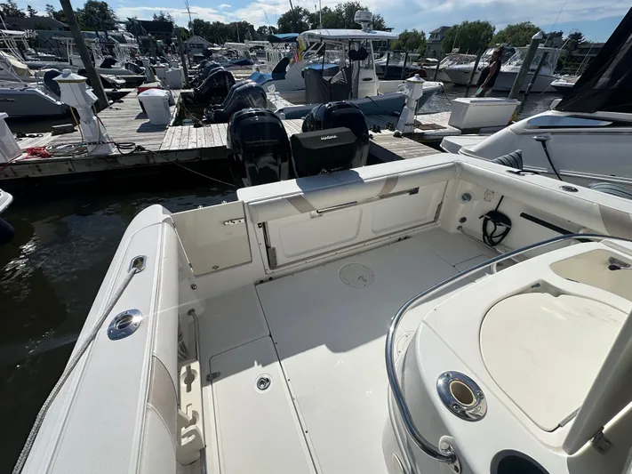 Block It Out Yacht Photos Pics 2005 Boston Whaler 320 Outrage boat docked at marina, showcasing spacious deck area.