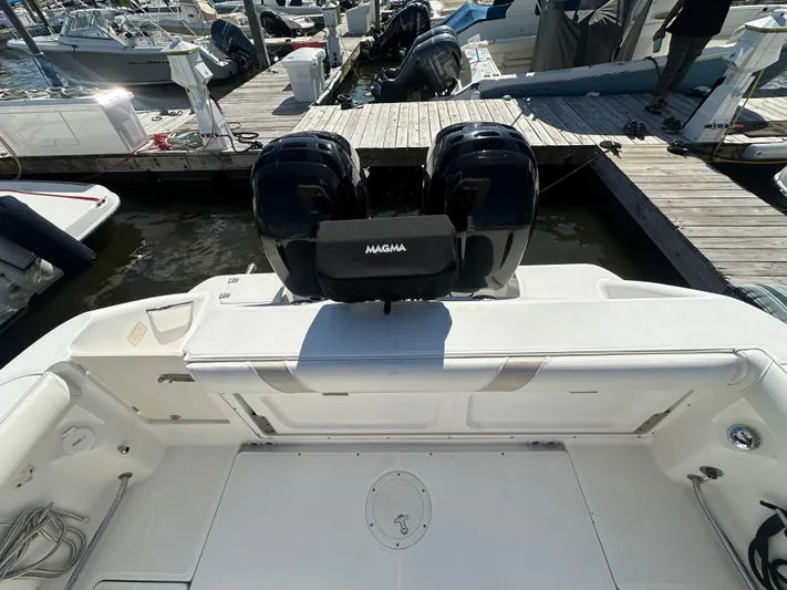 Block It Out Yacht Photos Pics 2005 Boston Whaler 320 Outrage at dock, featuring dual outboard engines.