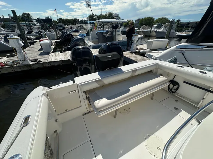 Block It Out Yacht Photos Pics 2005 Boston Whaler 320 Outrage at marina, featuring spacious deck and twin engines.