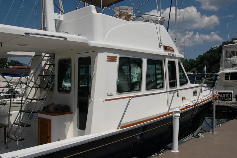 Eight Bells Yacht Photos Pics 2006 Sabre 36 Flybridge Sedan docked at marina under clear sky.