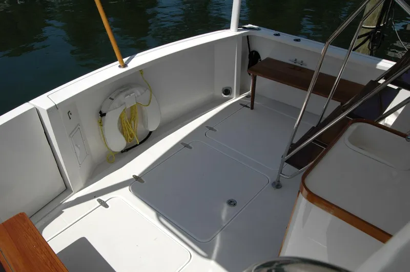 Eight Bells Yacht Photos Pics 2006 Sabre 36 Flybridge Sedan deck with life preserver and seating area.