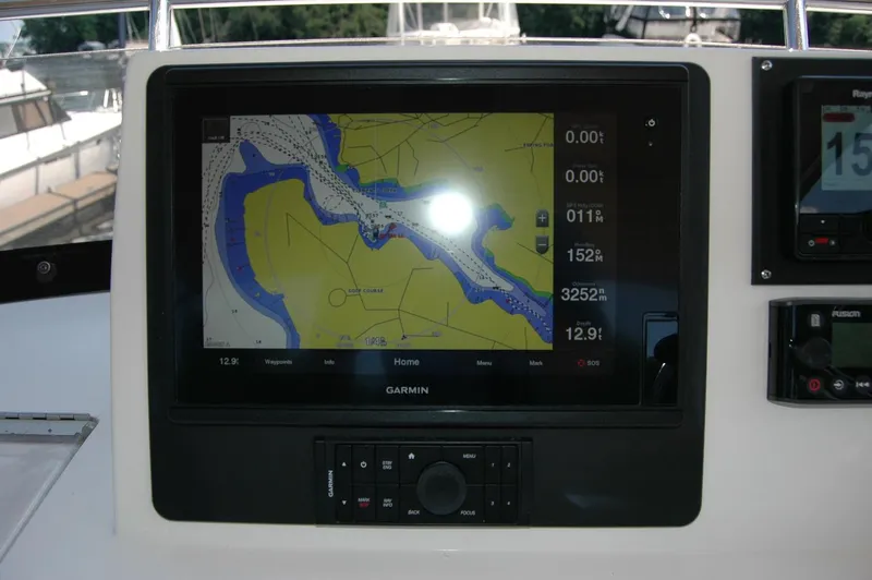 Eight Bells Yacht Photos Pics Garmin navigation display on 2006 Sabre 36 Flybridge Sedan boat dashboard.