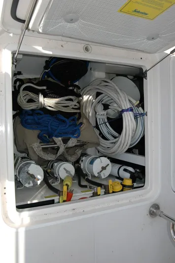 Eight Bells Yacht Photos Pics Storage compartment on a 2006 Sabre 36 Flybridge Sedan with ropes and equipment.