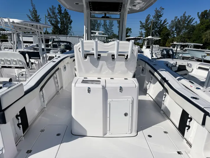  Yacht Photos Pics 2023 Tidewater 282cc Adventure Bluewater boat interior with sleek white design and spacious seating.