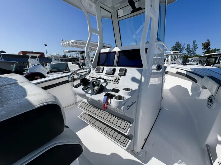  Yacht Photos Pics 2023 Tidewater 282cc Adventure Bluewater boat cockpit with modern controls and seating.