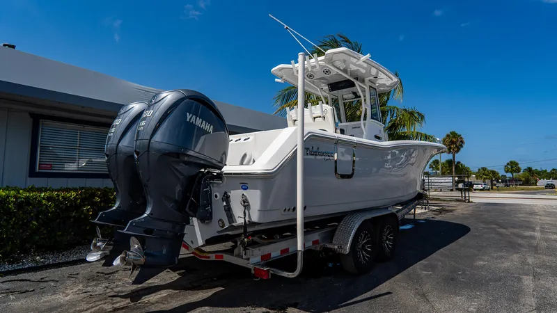  Yacht Photos Pics 2023 Tidewater 282cc Adventure Bluewater boat with Yamaha engines on a trailer.