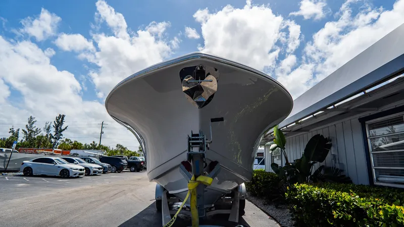  Yacht Photos Pics 2023 Tidewater 282cc Adventure Bluewater boat on trailer under blue sky.