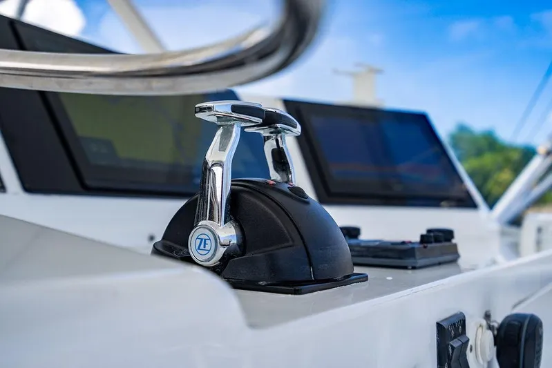 Energy Yacht Photos Pics Control panel of a 1998 Bertram Convertible yacht with throttle levers and navigation screens.
