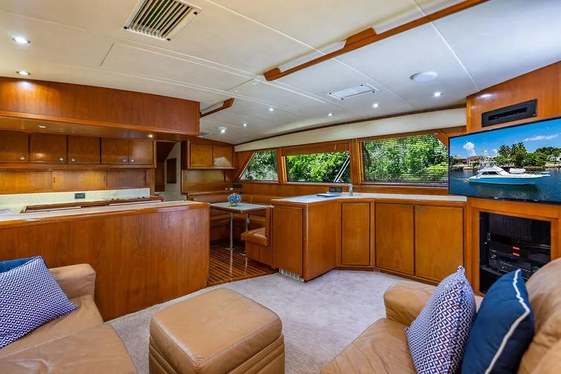 Energy Yacht Photos Pics Luxurious interior of a 1998 Bertram Convertible yacht with wood finishes and modern amenities.