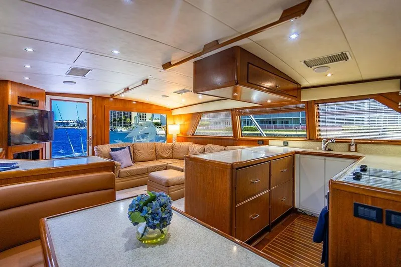 Energy Yacht Photos Pics Luxurious interior of a 1998 Bertram Convertible yacht with elegant wood finishes.