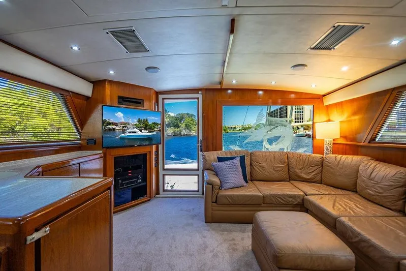 Energy Yacht Photos Pics Luxurious interior of a 1998 Bertram Convertible yacht with leather seating and scenic views.