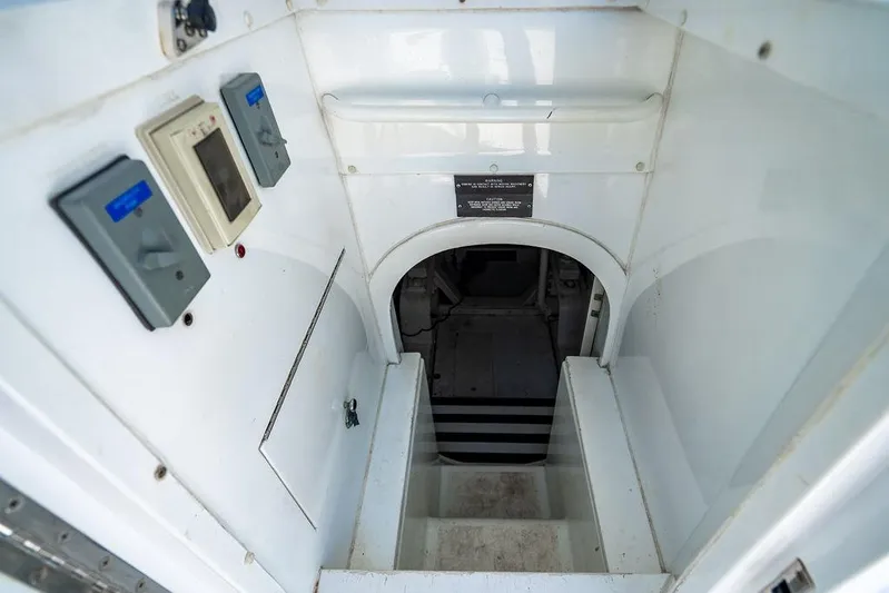 Energy Yacht Photos Pics Interior view of a 1998 Bertram Convertible yacht, showing stairs and control panels.