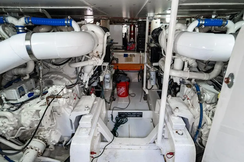Energy Yacht Photos Pics Engine room of a 1998 Bertram Convertible yacht with complex machinery and piping.