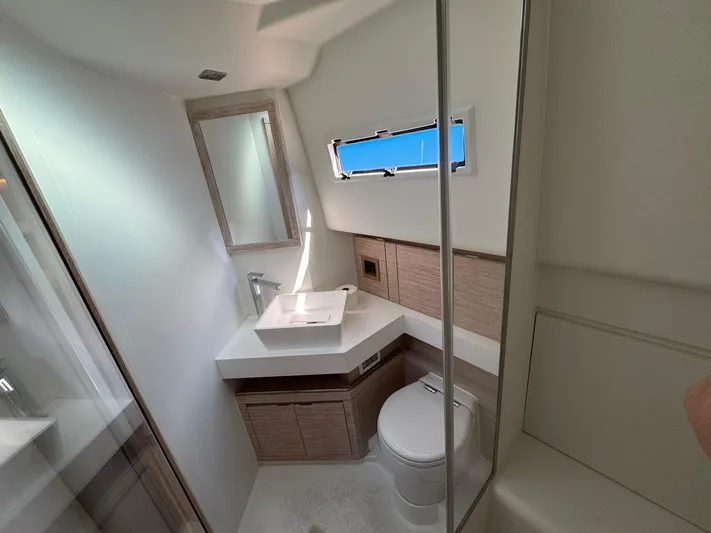 Yacht Photos Pics Modern bathroom interior of 2022 Pardo Yachts 43, featuring sleek design and compact layout.