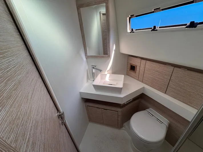  Yacht Photos Pics Modern bathroom in 2022 Pardo Yachts 43, featuring sleek design and compact fixtures.
