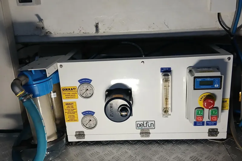  Yacht Photos Pics Control panel of a 2022 Sirena 58 yacht, featuring gauges and emergency stop button.