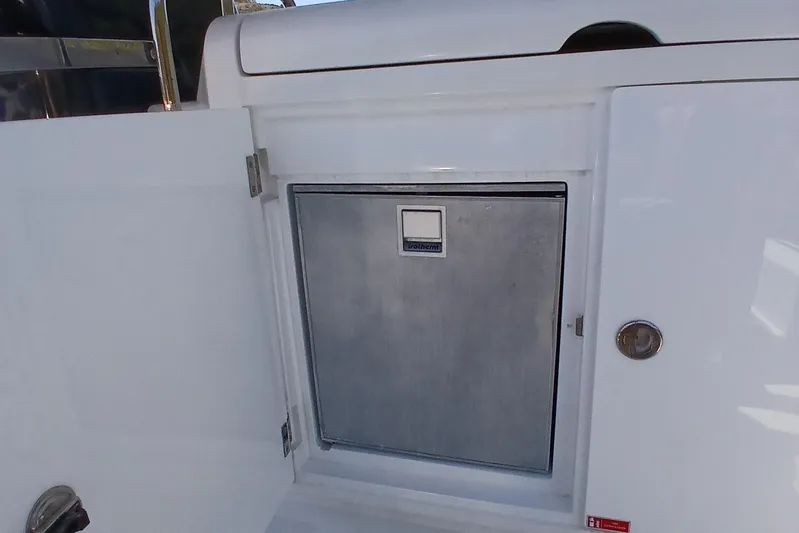  Yacht Photos Pics Storage compartment on a 2022 Sirena 58 yacht, featuring a built-in stainless steel door.