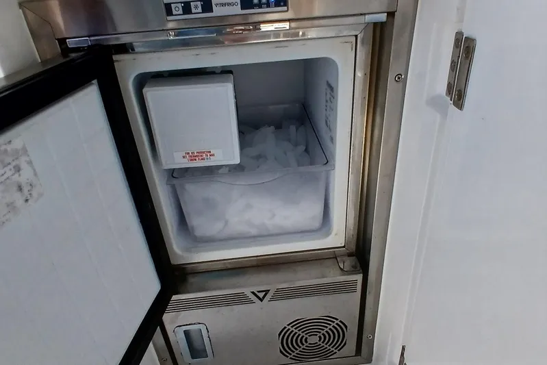  Yacht Photos Pics Open freezer with ice inside on a Sirena 58 yacht, 2022 model.