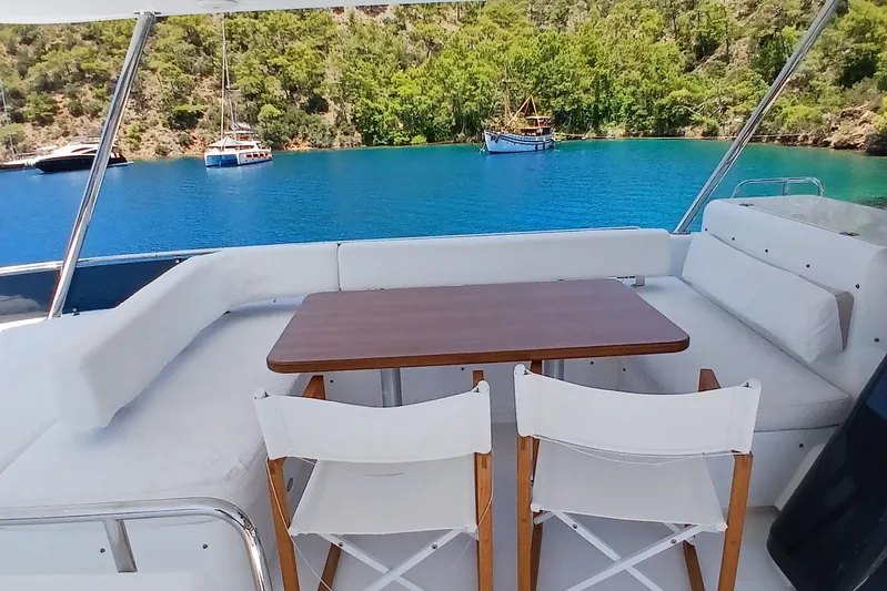  Yacht Photos Pics Luxury yacht Sirena 58, 2022 model, with elegant seating and scenic ocean view.