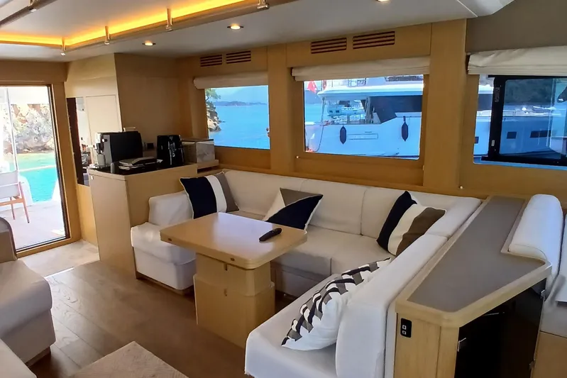  Yacht Photos Pics Luxurious interior of 2022 Sirena 58 yacht with modern seating and scenic views.