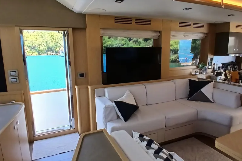  Yacht Photos Pics Luxurious interior of 2022 Sirena 58 yacht with modern furnishings and scenic ocean view.