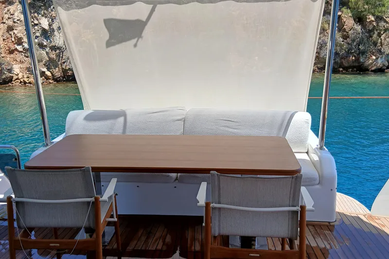  Yacht Photos Pics Outdoor seating area on 2022 Sirena 58 yacht with ocean view.