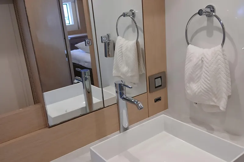  Yacht Photos Pics Modern bathroom in 2022 Sirena 58 yacht with sleek sink and towel holder.
