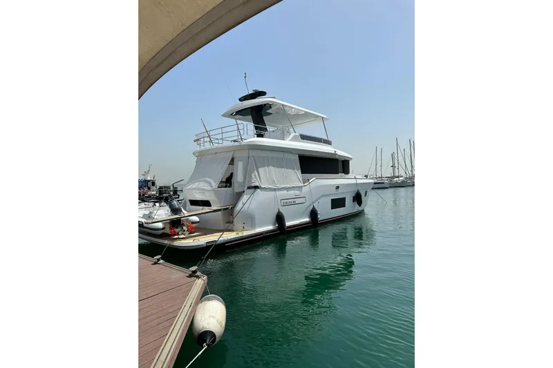  Yacht Photos Pics Luxury Sirena 58 yacht docked at marina, 2022 model, clear sky, calm water.