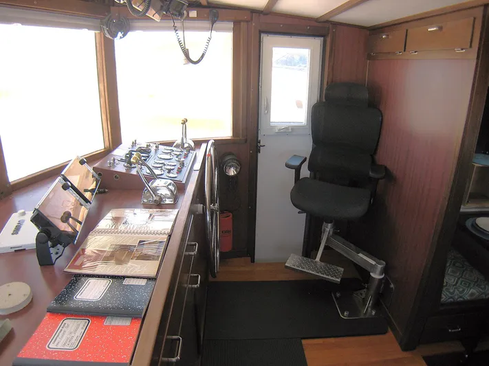 Resolute Yacht Photos Pics 1987 Custom Pilgrim Tribute boat interior with control panel and captain's chair.