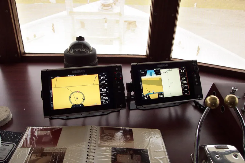 Resolute Yacht Photos Pics Pilgrim Tribute 1987 boat dashboard with navigation screens and controls.